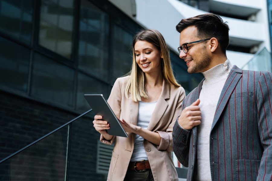 stock-photo-two-creative-business-people-working-on-social-media-strategy-using-a-digital-tablet-2067271643-1