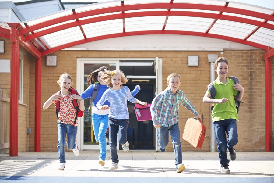 stock-photo-schoolchildren-running-into-playground-at-end-of-class-343101845
