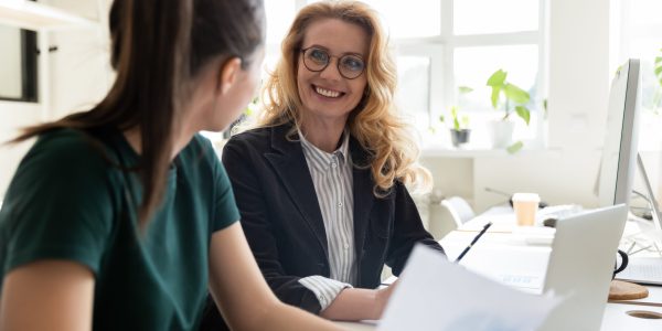 stock-photo-older-and-young-office-worker-women-workmates-sit-at-shared-desk-working-together-do-statistical-1613073508 stock-photo-older-and-young-office-worker-women-workmates-sit-at-shared-desk-working-together-do-statistical-1613073508