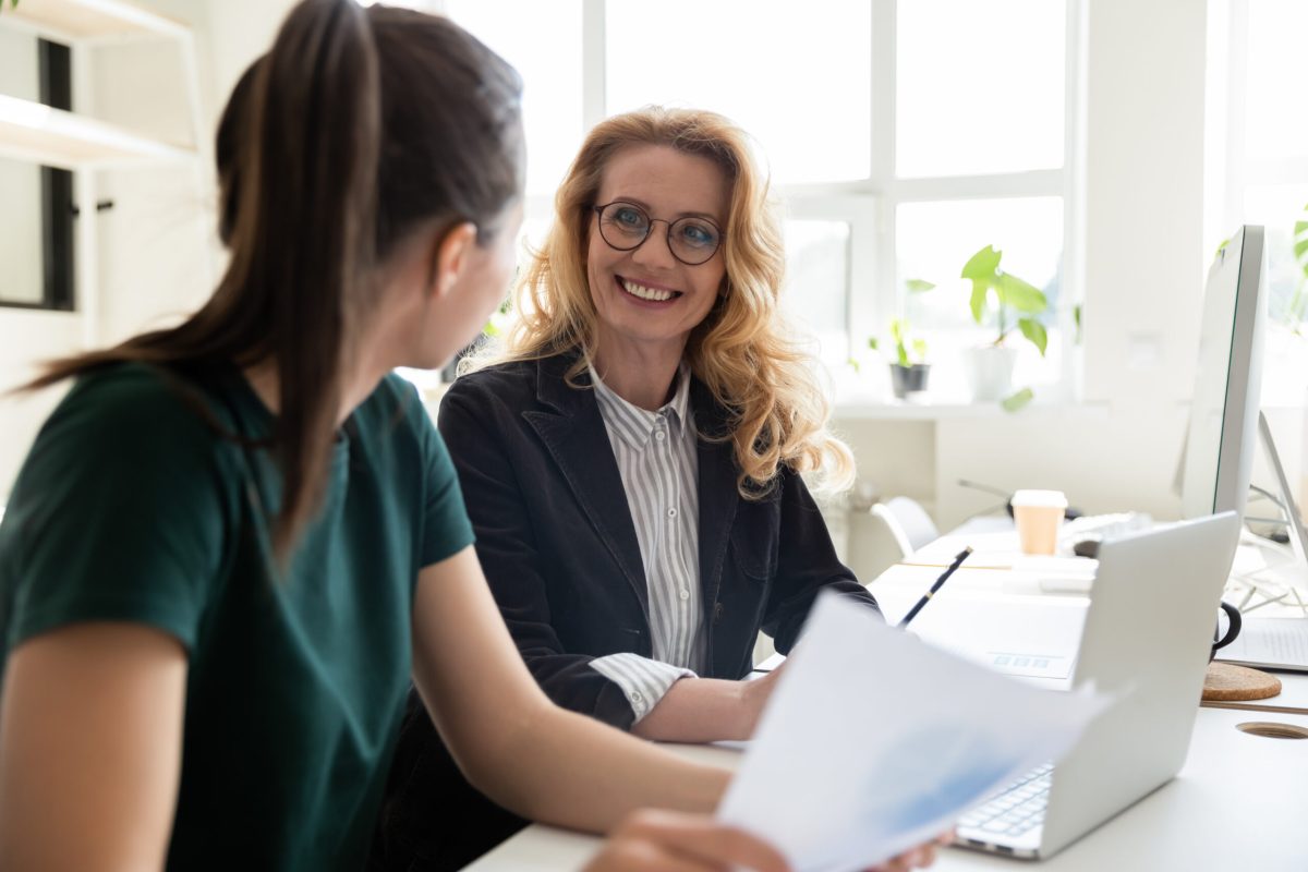 stock-photo-older-and-young-office-worker-women-workmates-sit-at-shared-desk-working-together-do-statistical-1613073508 stock-photo-older-and-young-office-worker-women-workmates-sit-at-shared-desk-working-together-do-statistical-1613073508